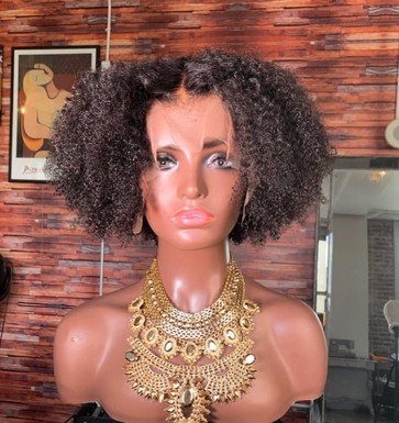Before: curly wig on a mannequin