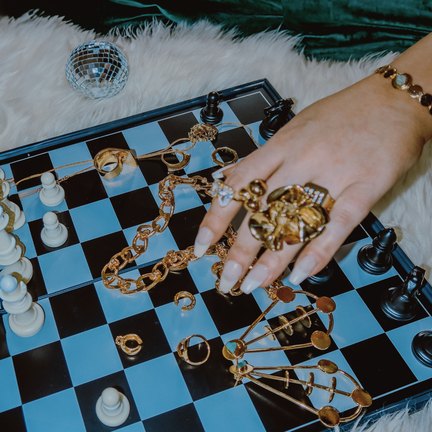 Nashrow jewelry on a checkerboard