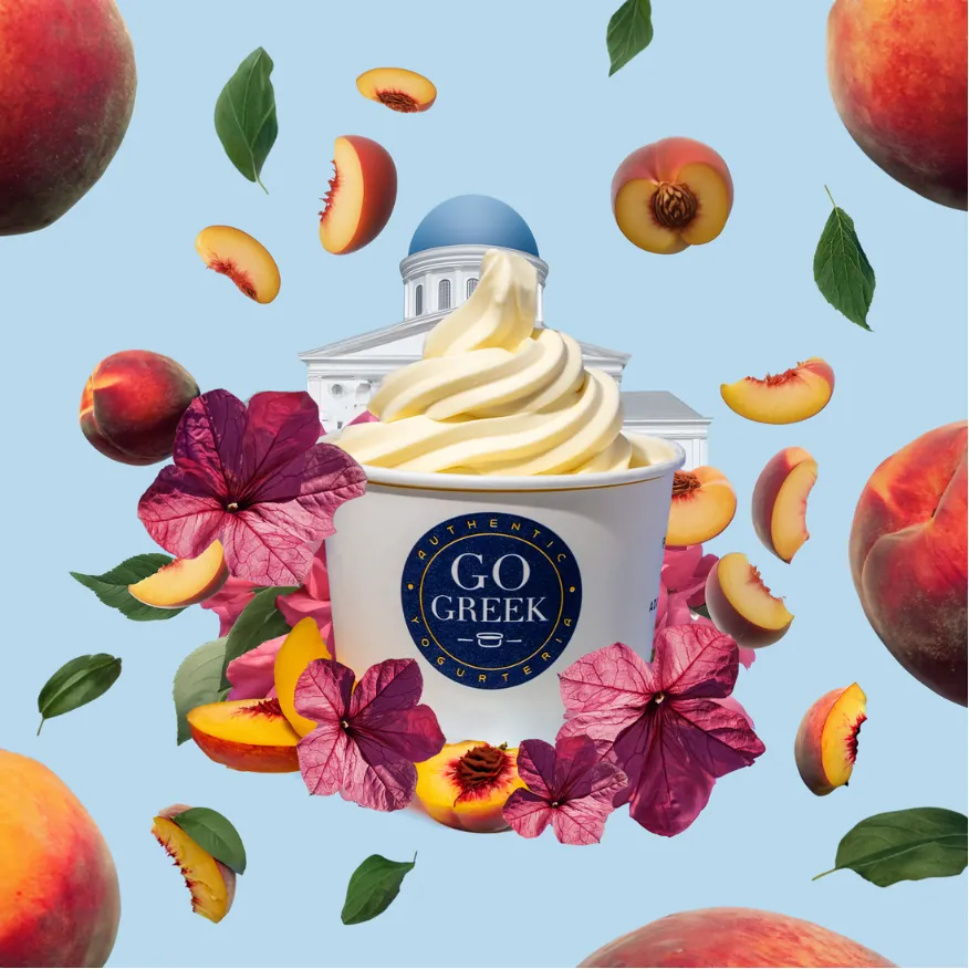 Go Greek Yogurt cup surrounded by peaches and flowers